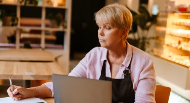Small business owner reviewing advertising performance